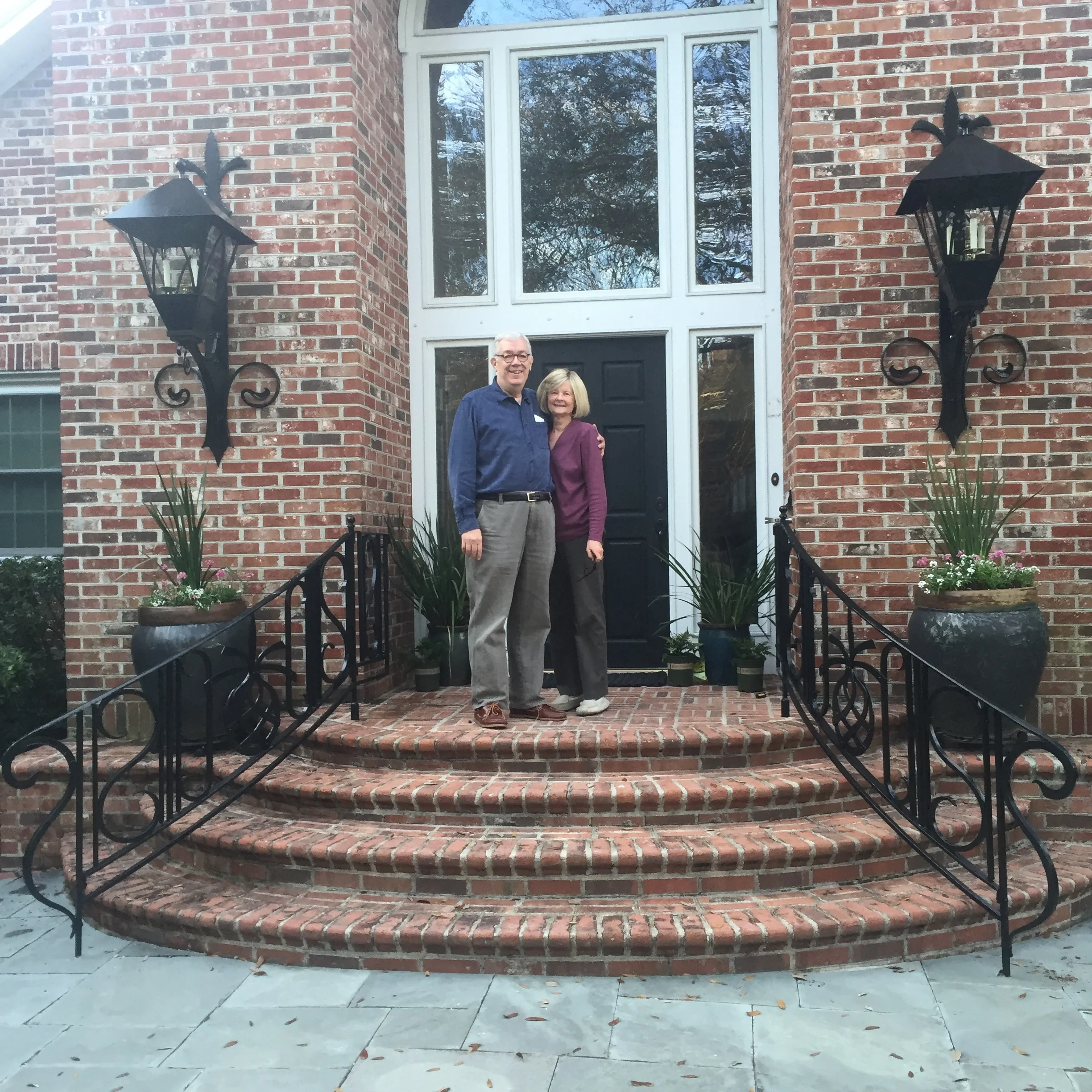 Curved entrance railings and matching lanterns