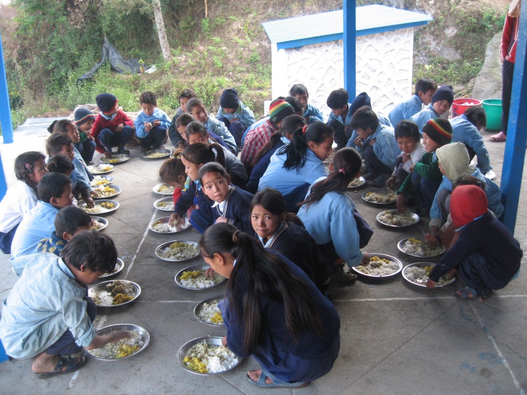 Community-Support-Gurje-Food-for-Education-group-eating-1024x768.jpg
