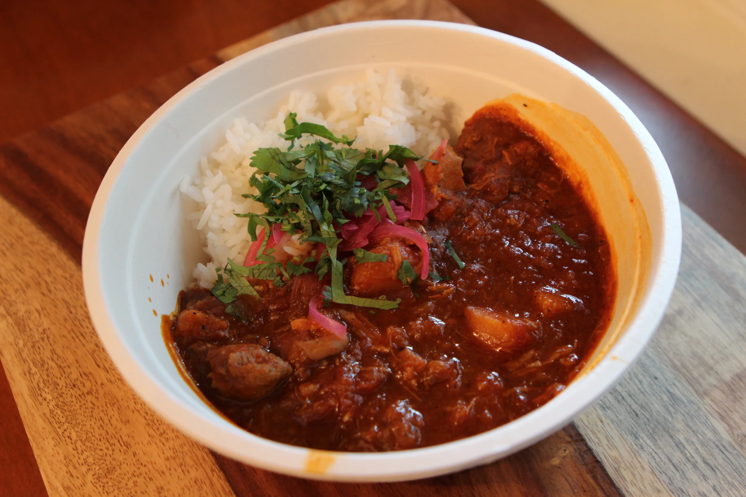 Smoked Chicken and Chili Stew - Pasilla, miso and honey laced stew of smoked free-ranged chicken and butternut squash. Carolina rice with pickled red onion.