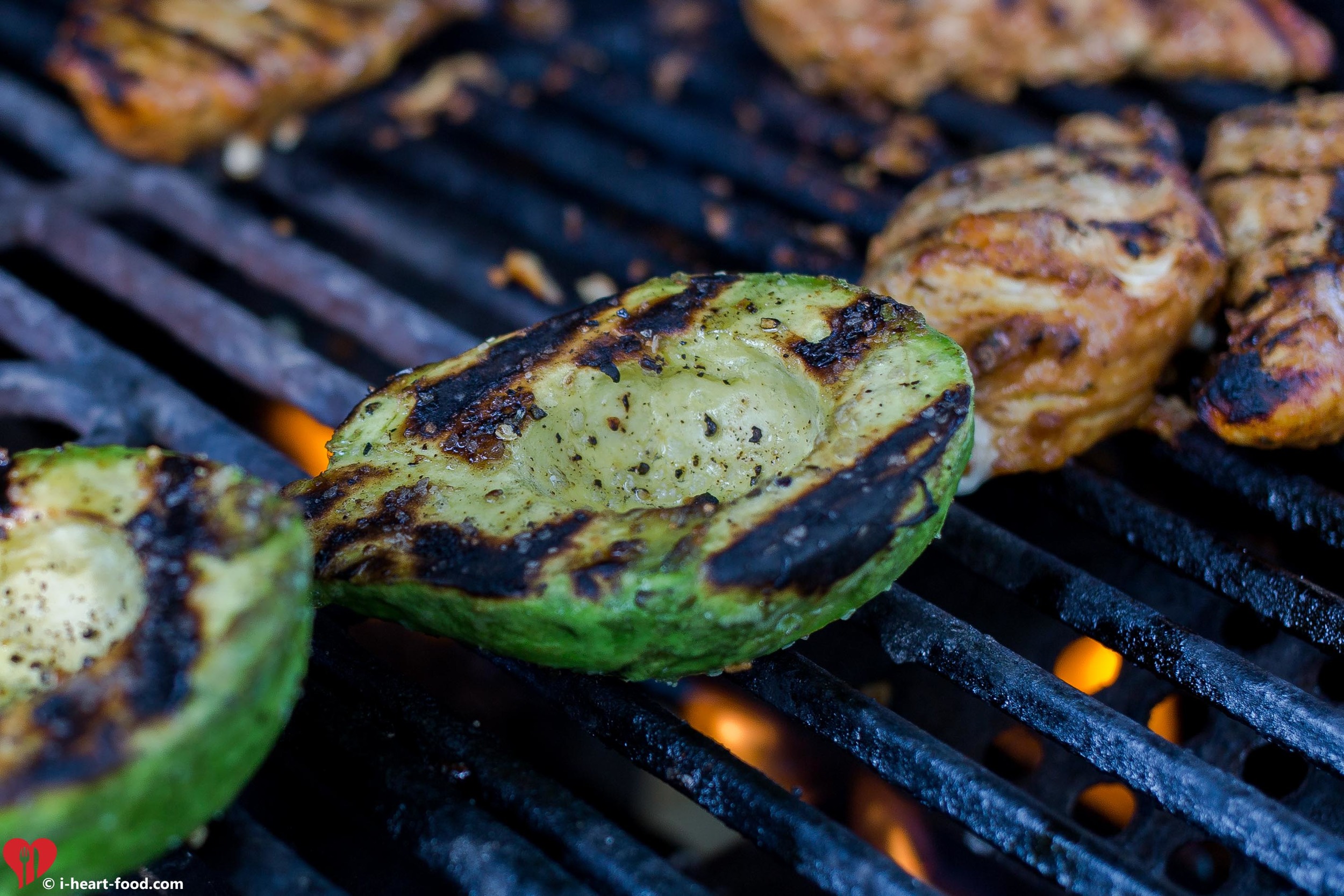 Avocado on the grill with some chicken breast.