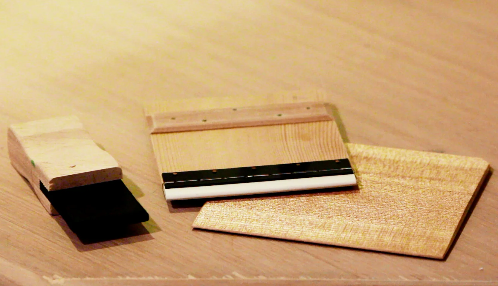 a selection of spatulas for applying resist paste to fabric in katazome