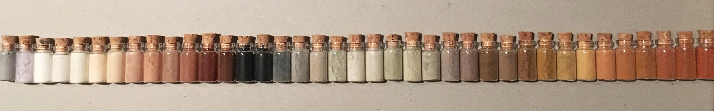 "Tiny Museum of Natural Pigments" work in progress, 2018. Glass vials 2.5cm. Colours from rocks, soil, shells, ash.