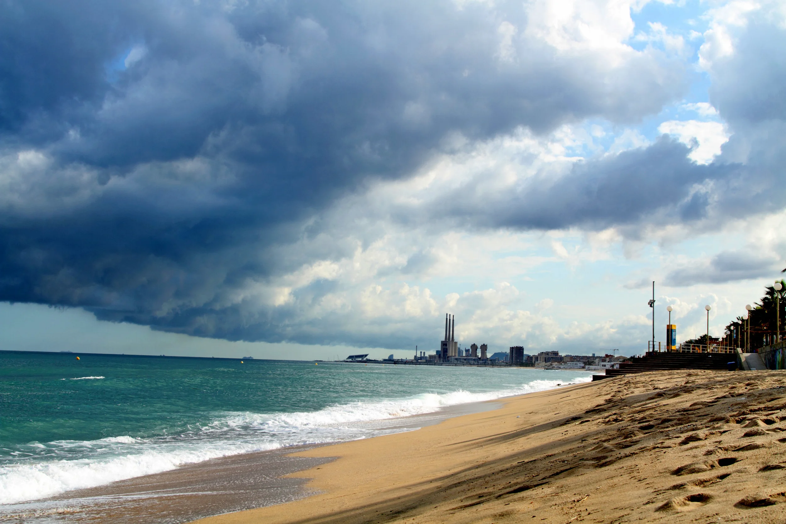 SPAIN_RAIN CLOUDS_SHORELINE OCEAN_CITY BACKGRouND_2.jpg
