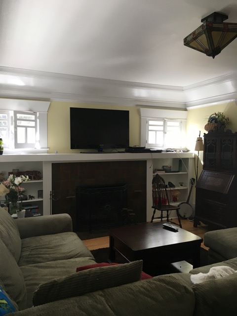 Built in bookcases frame the fireplace as you enter into the living room.