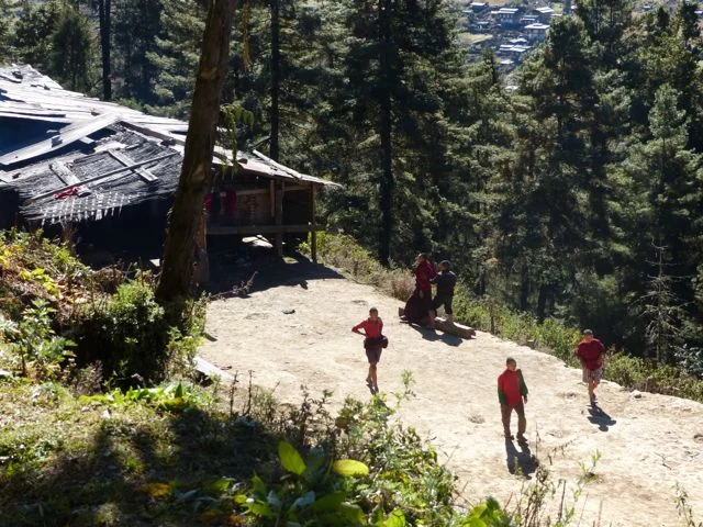 Young monks playing soccer.jpg