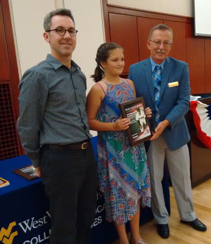 Awarding art prize to WV 6th Grader.