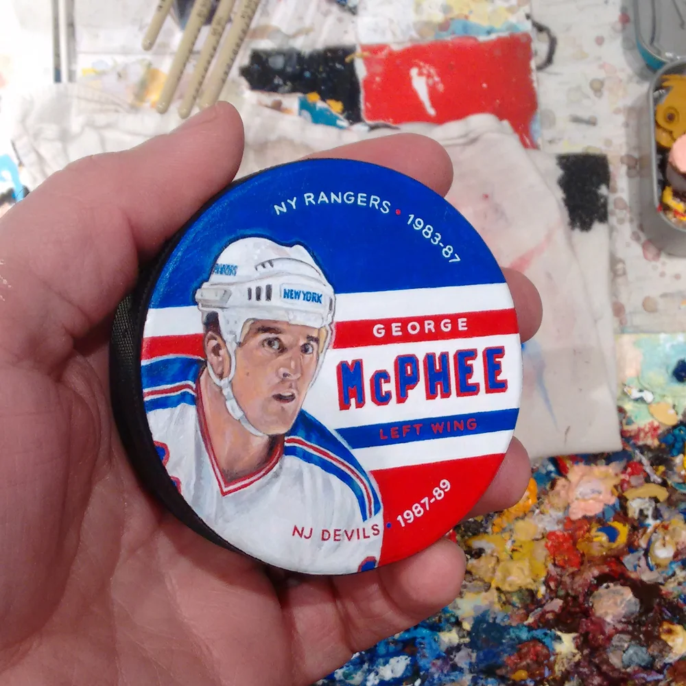 Example of Painted Puck nearing completion in my studio. This George McPhee hockey puck artwork is NOT available.
