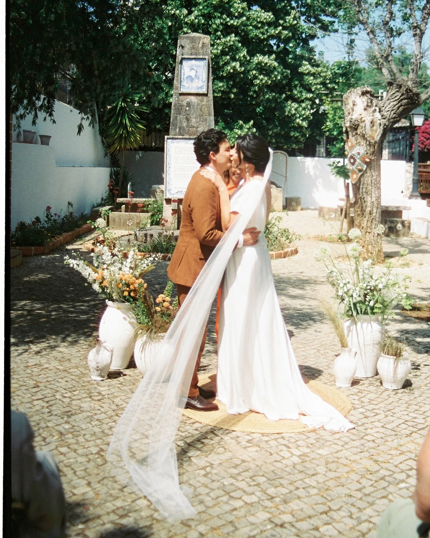 This day felt nothing short of magical. A &amp; J exchanged their vows by the same fountain where Andreia had spent her childhood, the very same place she later shared with Joe as he began to meet her loved ones. Guiding their words and the poetry of