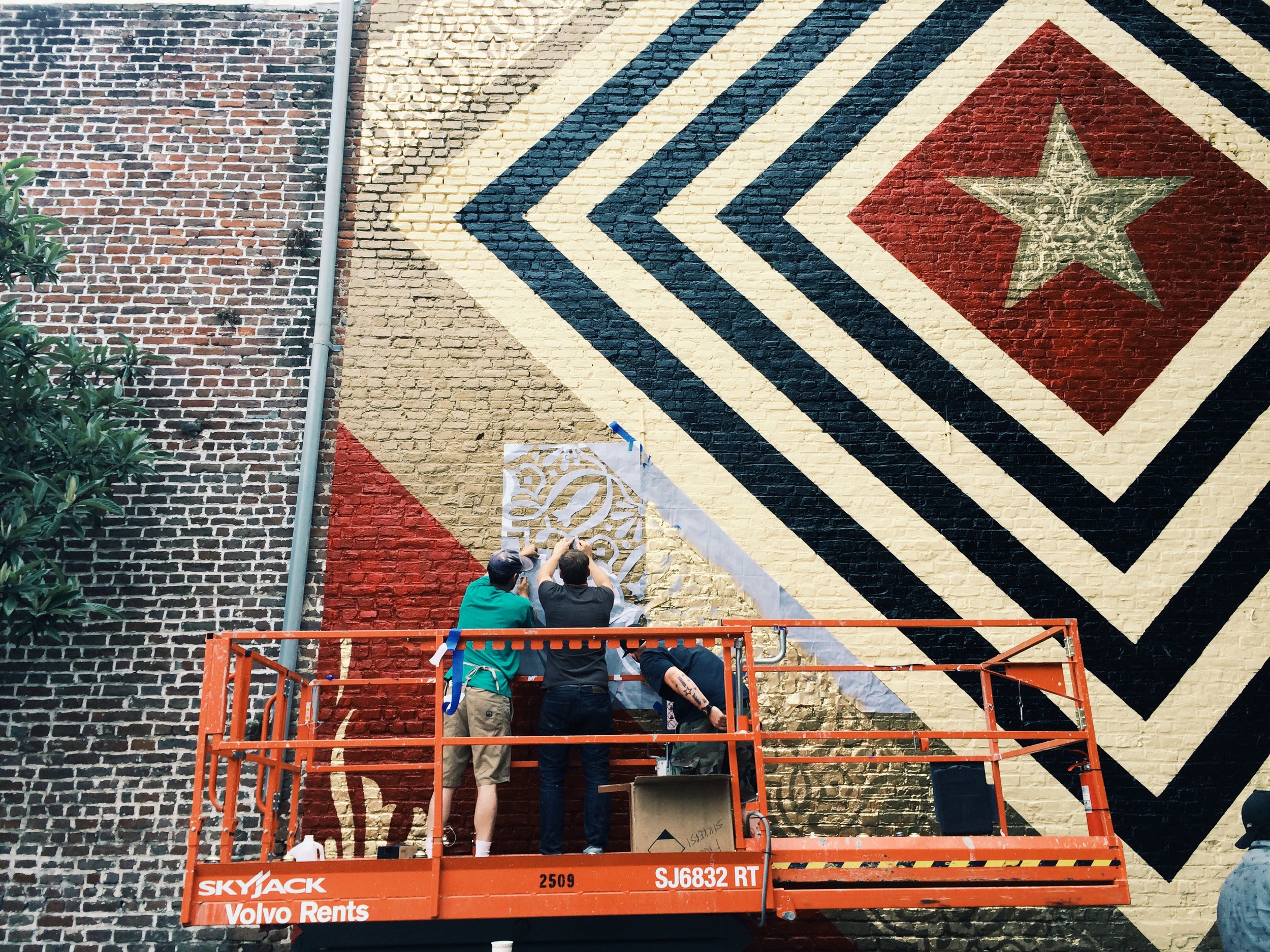 Shepard Fairey stenciling in detail on King Street