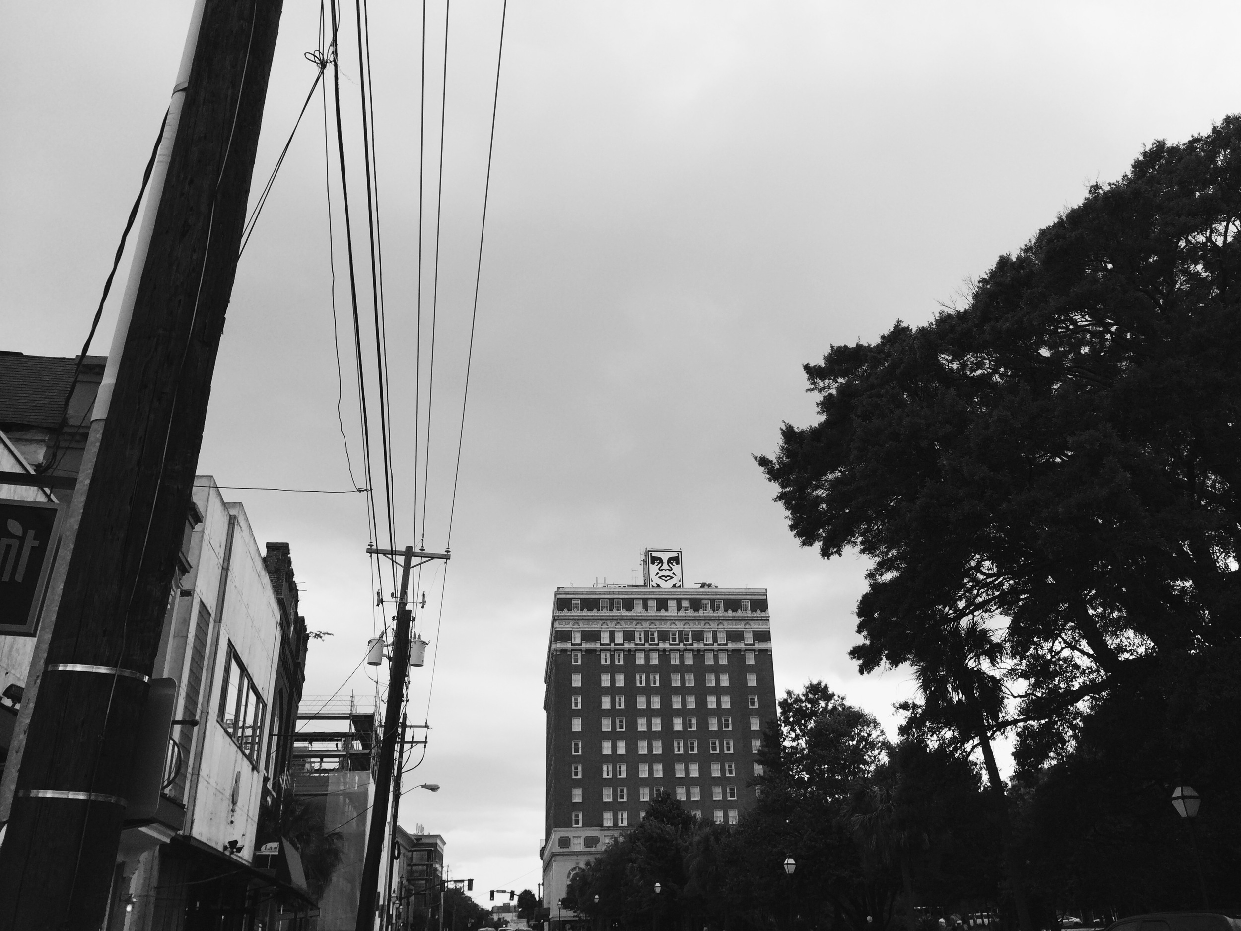 OBEY on top of the Francis Marion Hotel