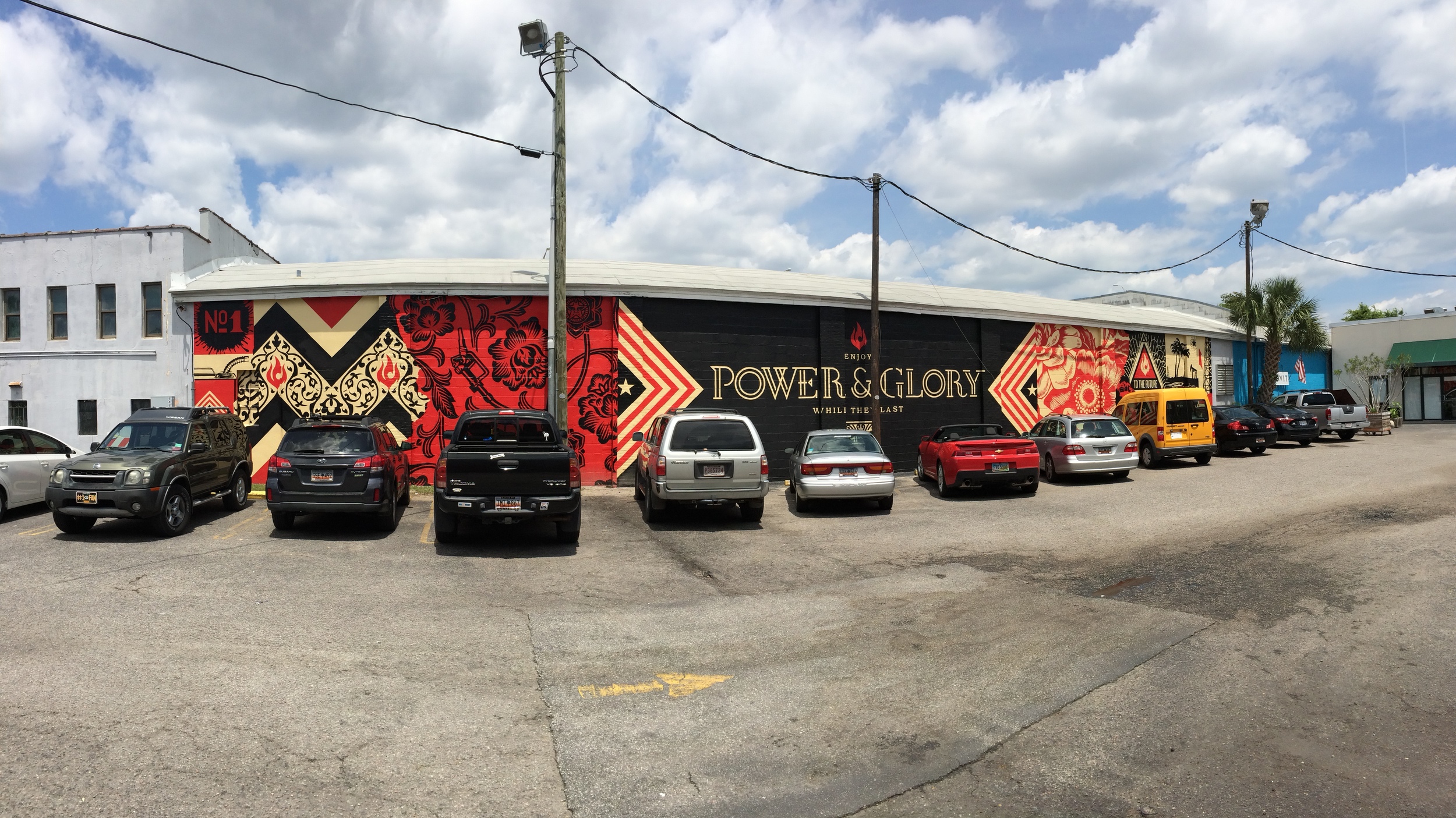 Power &amp; Glory mural lining the parking lot outside of Butcher and&nbsp;Bee