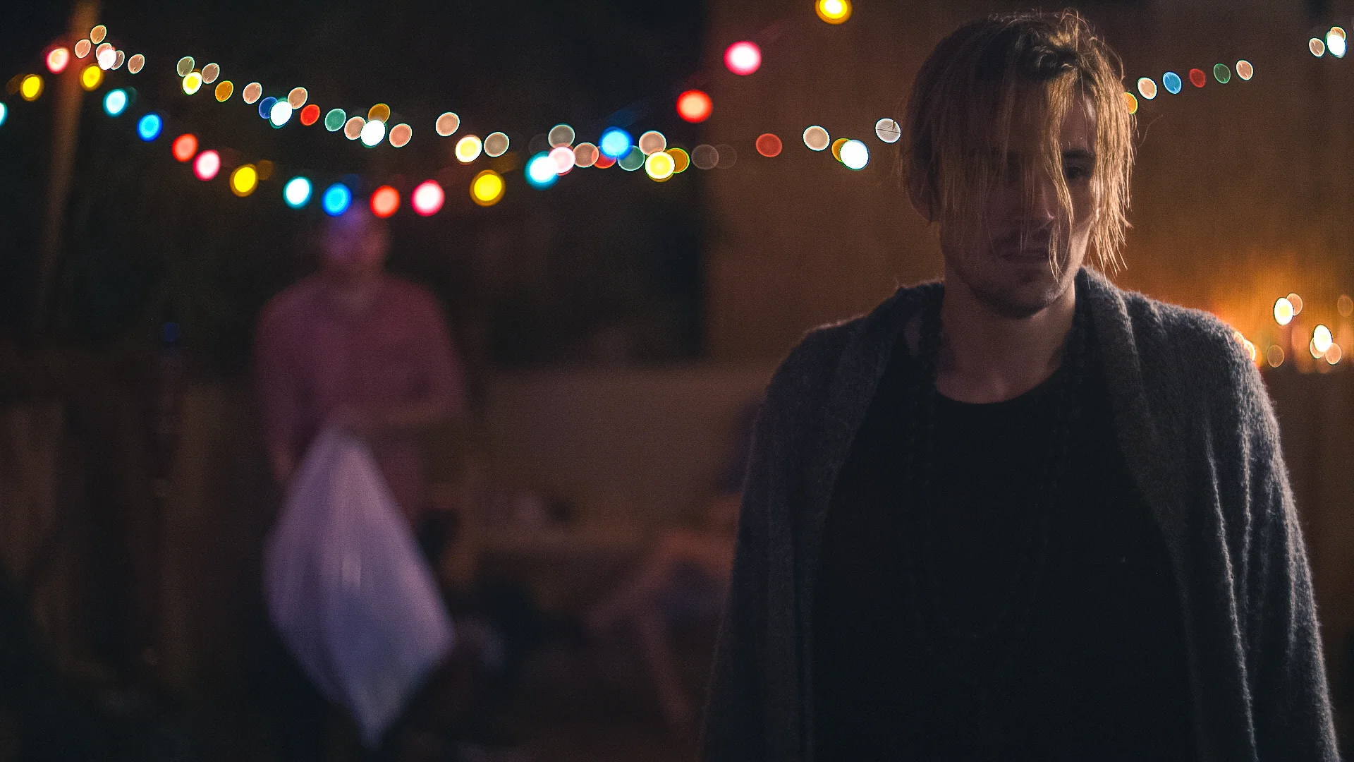 Man_With_Hair_Covering_Face_At_Night.jpg