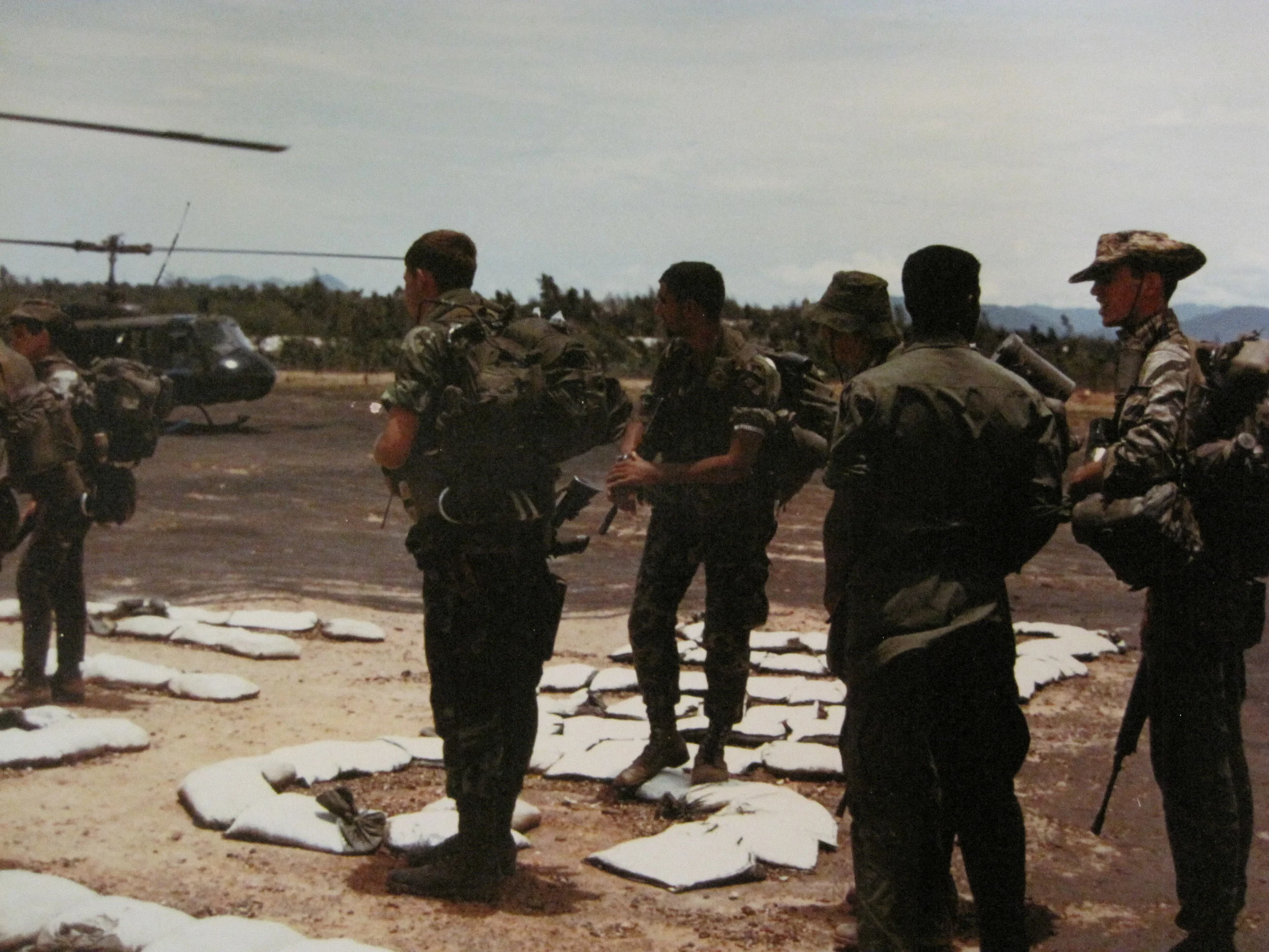 LZ Betty en route to patrol. Bruce Cain left without hat, me, and Tony Griffith