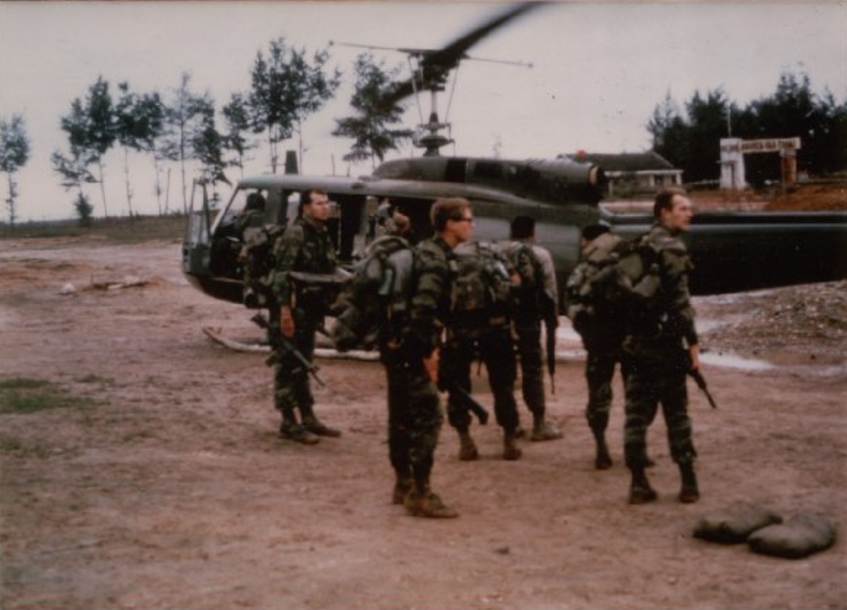  Boarding a Huey for a patrol (Cpls Forrest Decker and Burt Penkunis in foreground)