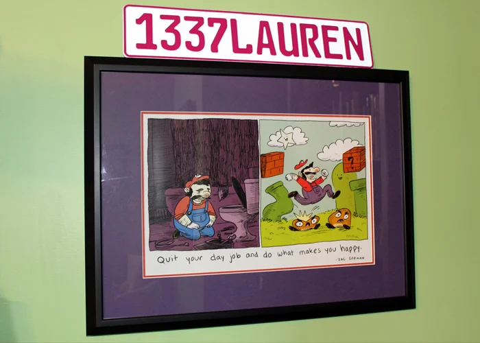 More nerdy and fun artwork displayed near the convention badges.