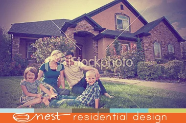 family-of-four-on-lawn-with-beautiful-home-in-background.jpg