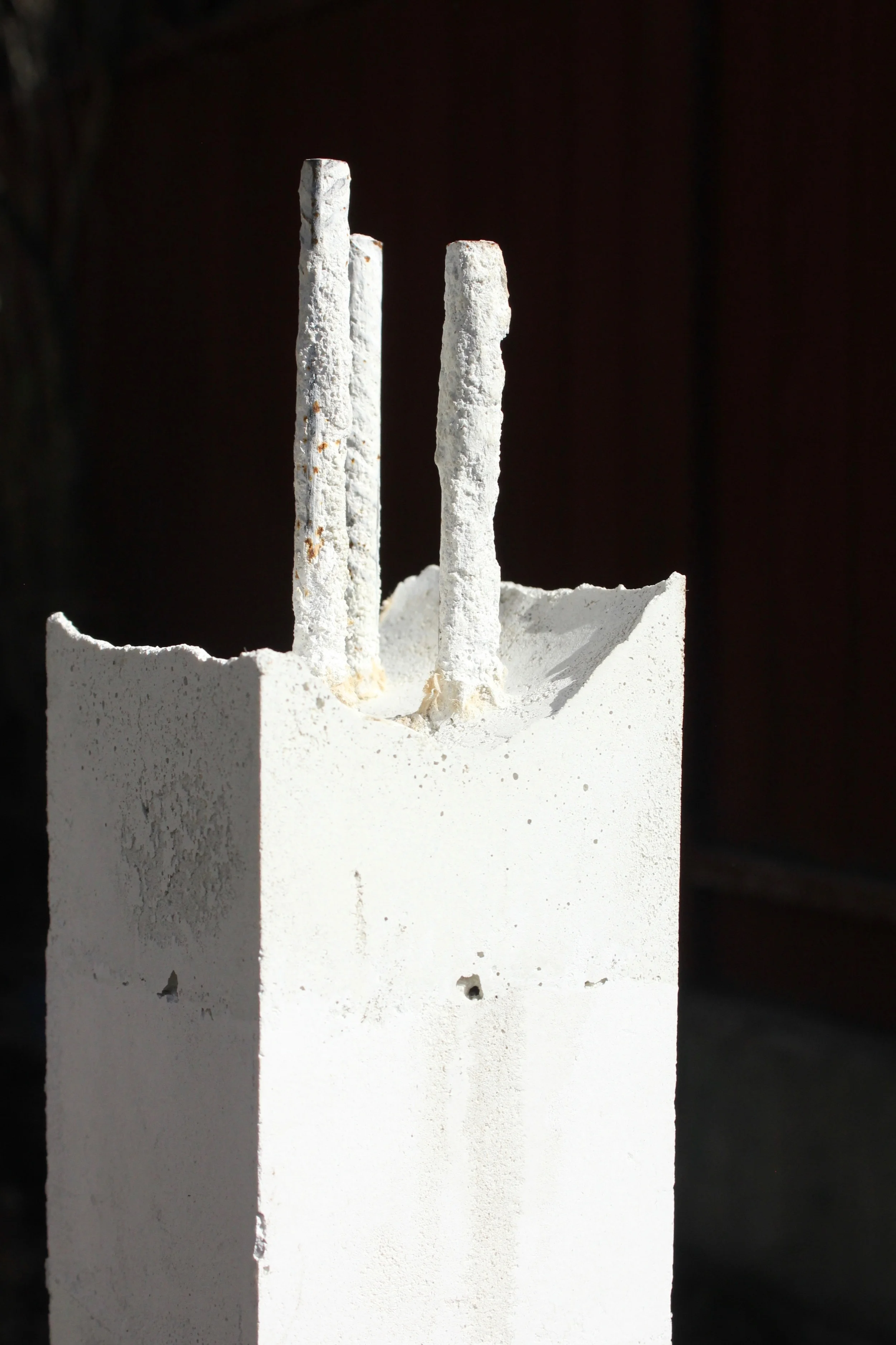 Melting Tower is designed around alternating concrete and softer plaster bands, bound by exposed rebar, arranged so that the object's structure is revealed over time by the forms of entropy we know as erosion and corrosion.