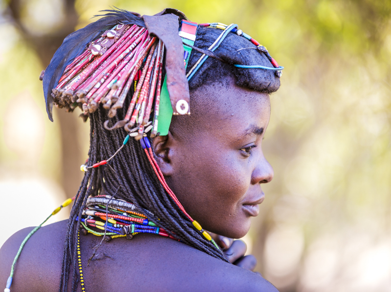 In a world where there are no facilities, everything gets used. Here the Mucawana decorate their hair with "ringlets" made from Coca-Cola tins. Soba, Cunene Province ©24Atlantic