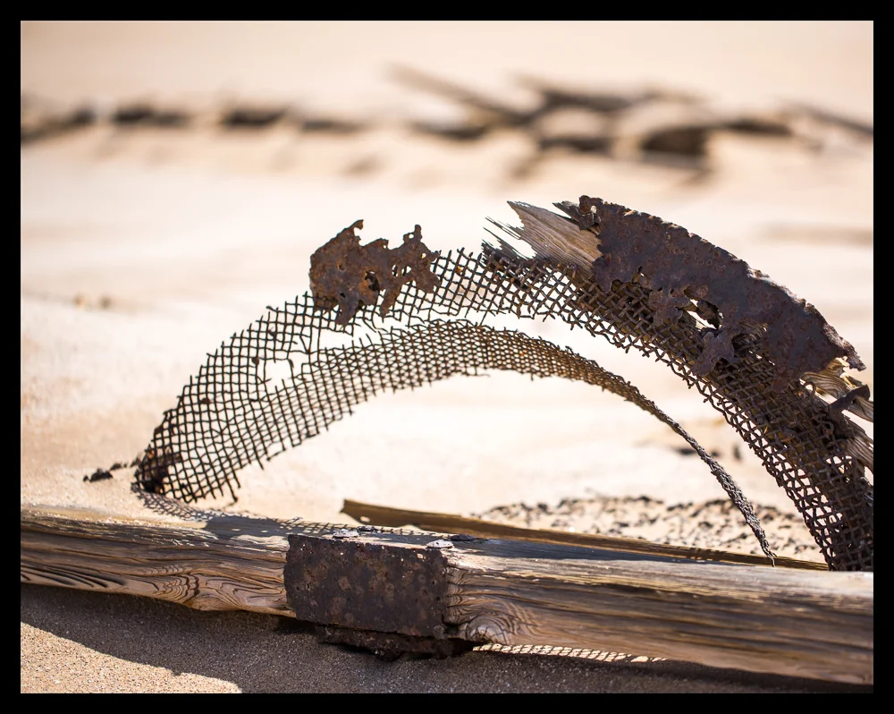 Fragments of sieves used for separating the rocks from the finer sand containing the diamonds.