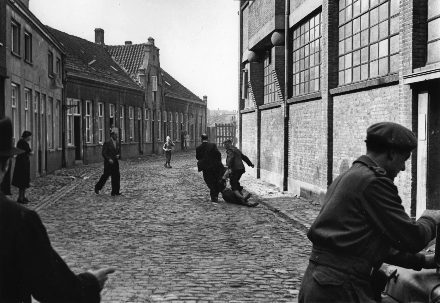 A fifth columnist is dragged through the streets of Eindhoven, Holland 1944