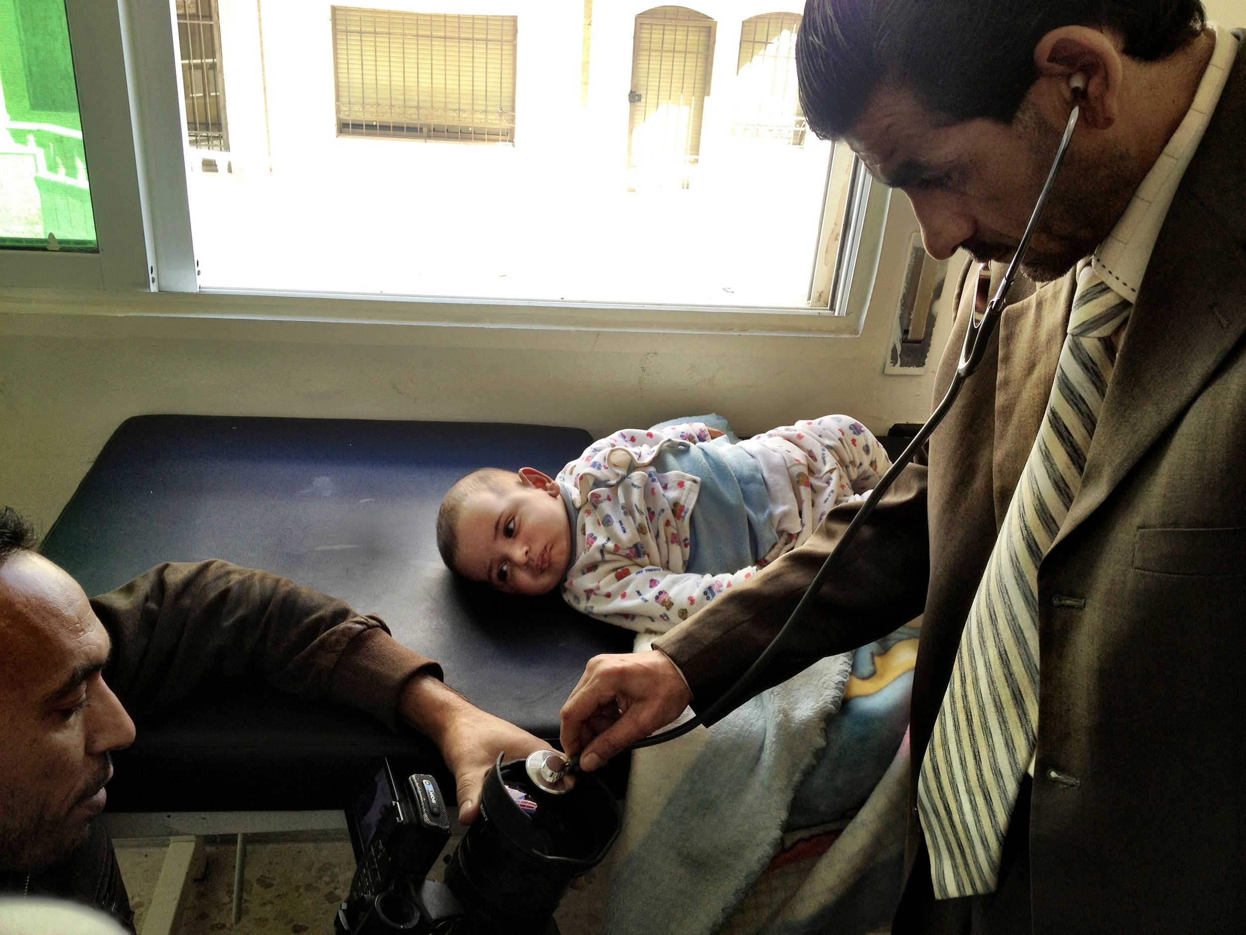 A Syrian refugee infant boy