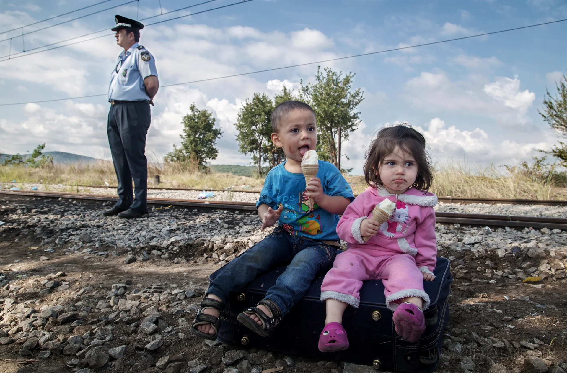 A long and difficult day on the Greek-Macedonian border, with hundreds of refugees waiting for hours in the sweltering heat to be able to cross. There there was no aid presence whatsoever in the early hours of the morning -- just us and the Macedonian riot police. By the afternoon, a handful of volunteers began to trickle in to help. An ice cream vendor set up his cart right next to the border crossing, but not before treating several dozen children to free cones.