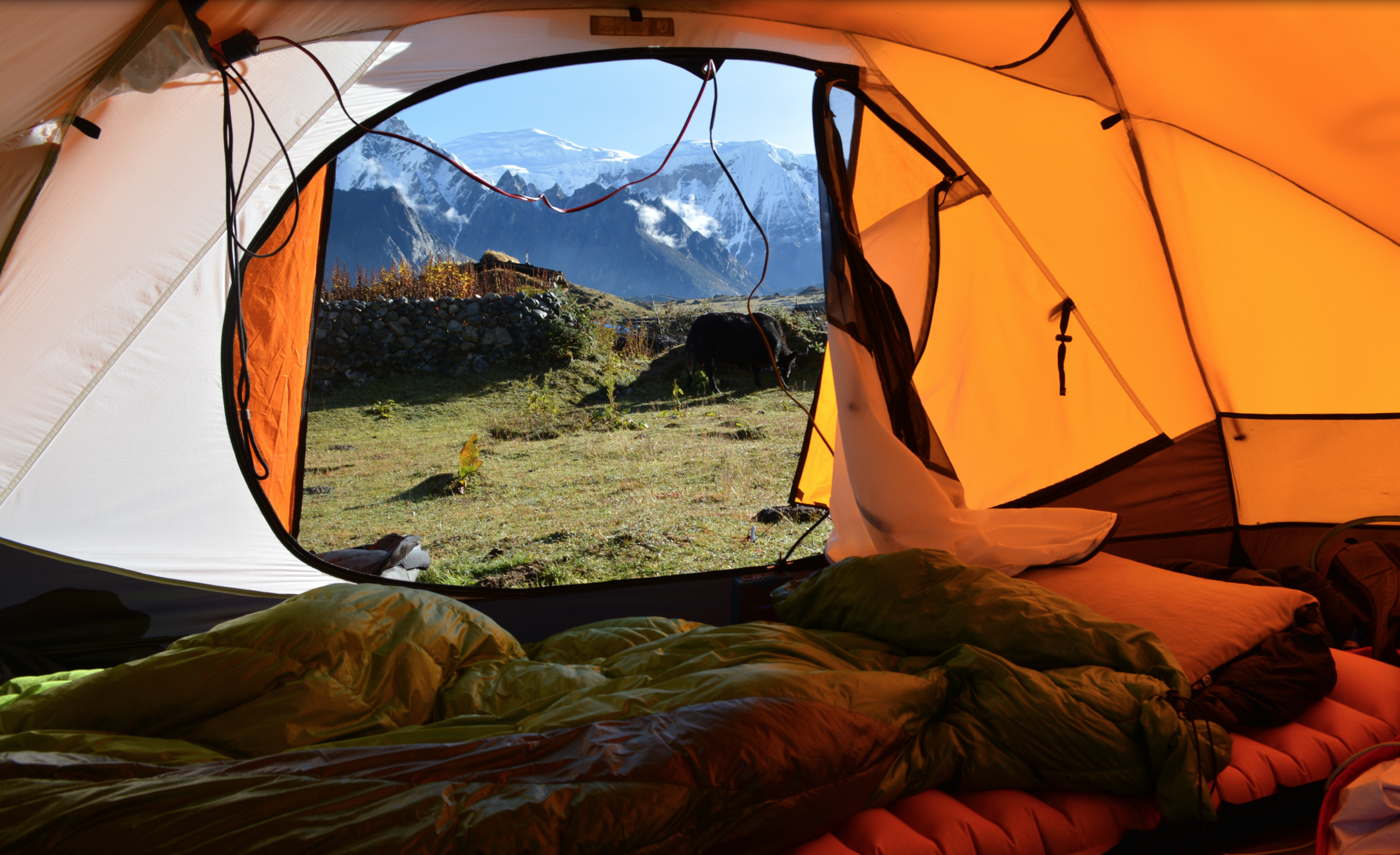 Picture is the NEMO Alti Storm 3P Tent, Insulated Cosmo XL sleeping pad, Nocturne prototype sleeping bag, and Fillo camp pillow