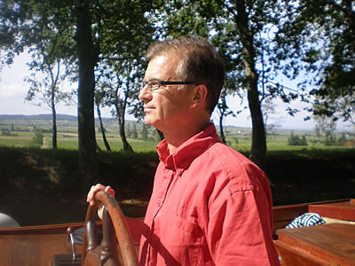 Alegria Captain Olivier at the wheel.jpg