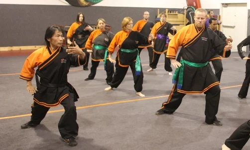 master Su Tong Yu leading monk Wise students in taijiquan (Tai Chi)