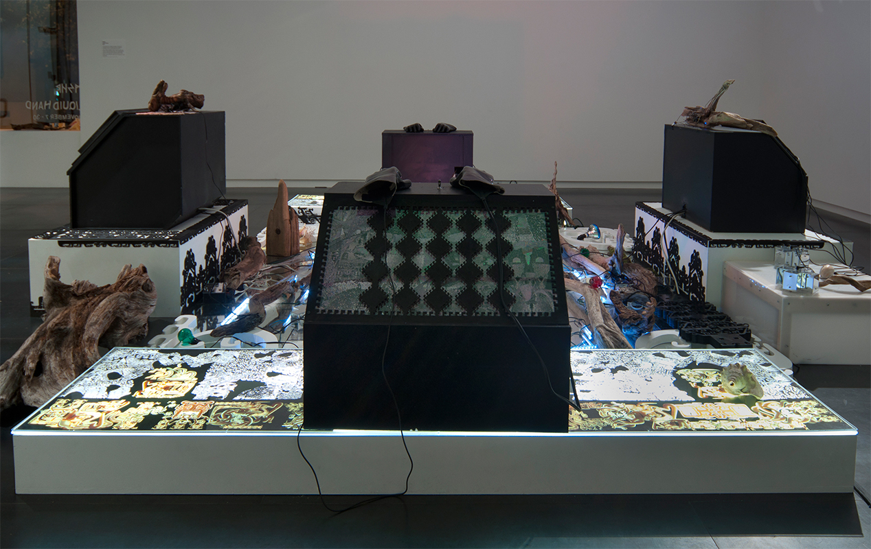 Controller Station (Glove Console) , 2013 30 x 24 x 24 inches, electronics, digital print, laser-cut wood, gloves. Speakers and attached equipment not included.