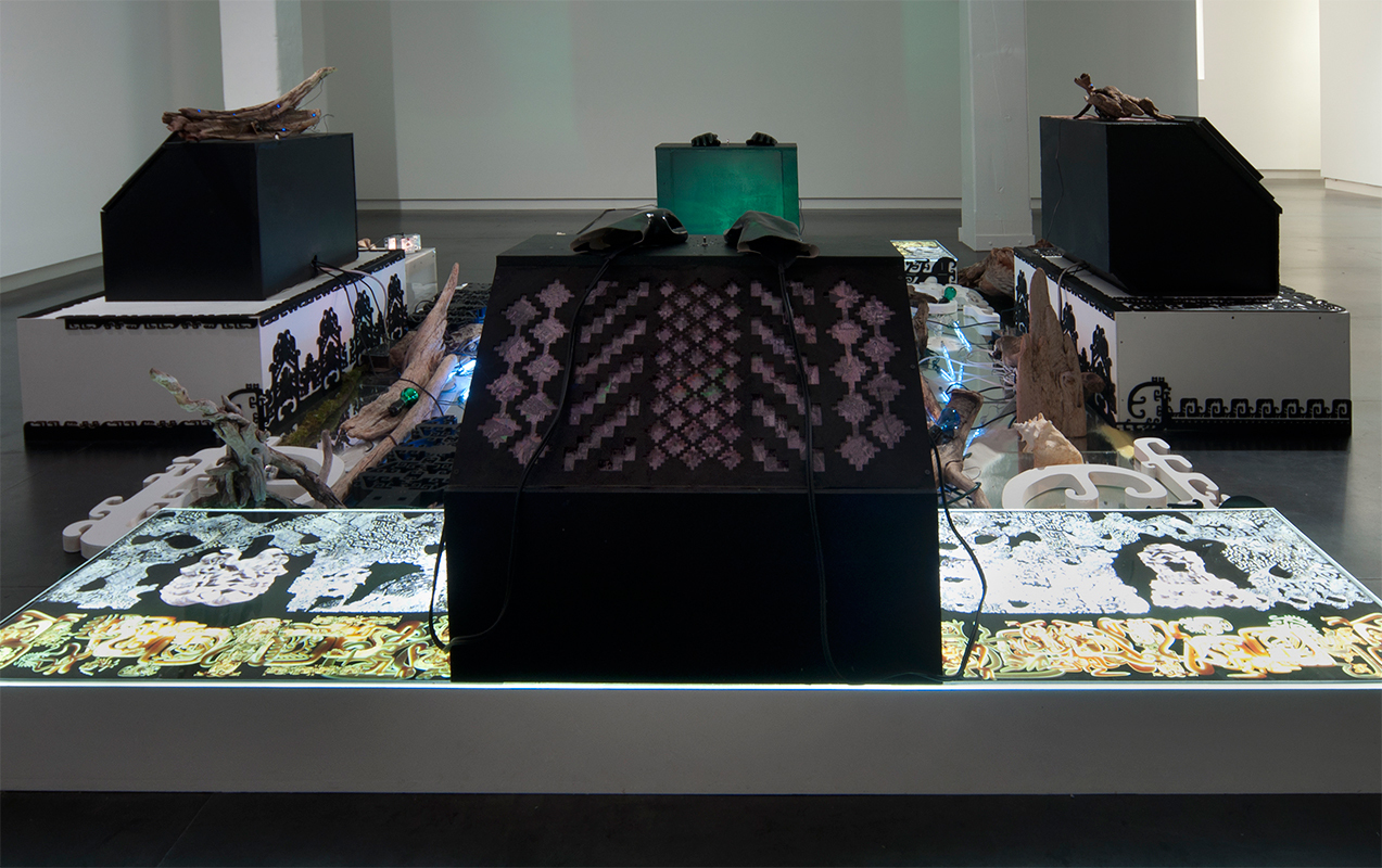 Controller Station (Glove Console) , 2013 30 x 24 x 24 inches, electronics, digital print, laser-cut wood, gloves. Speakers and attached equipment not included.