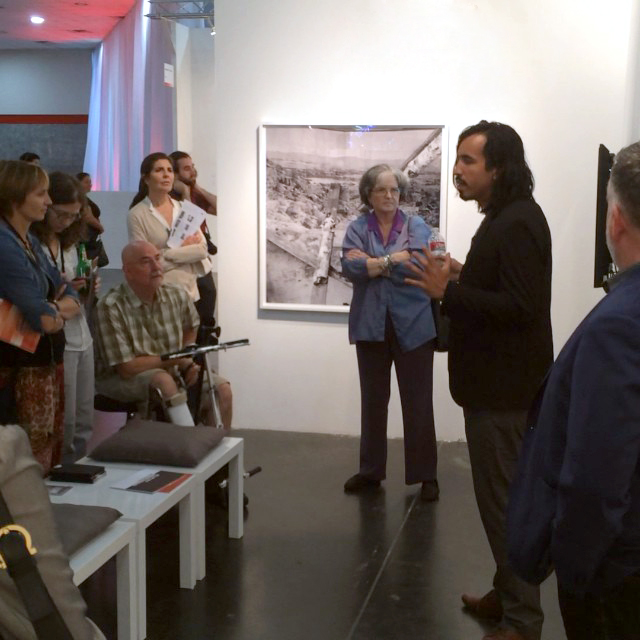  Rodrigo Valenzuela giving a talk to the FotoFest Collector's Circle tour. 