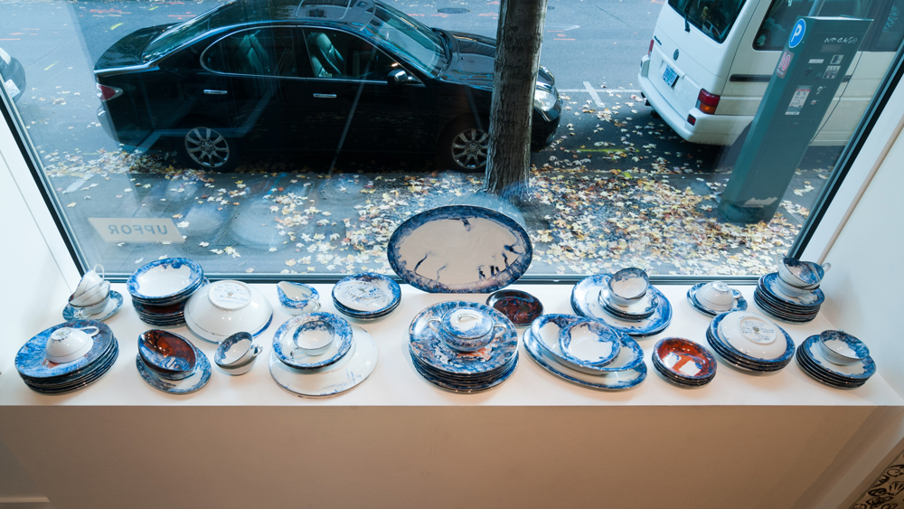   An Embarrassment of Dishes , 2015 blue pigment, 7-Up and simple syrup, painted and kiln fired on a 1961 set of Noritake dishware, service for 12 Technical assistant: Toni Acock. 