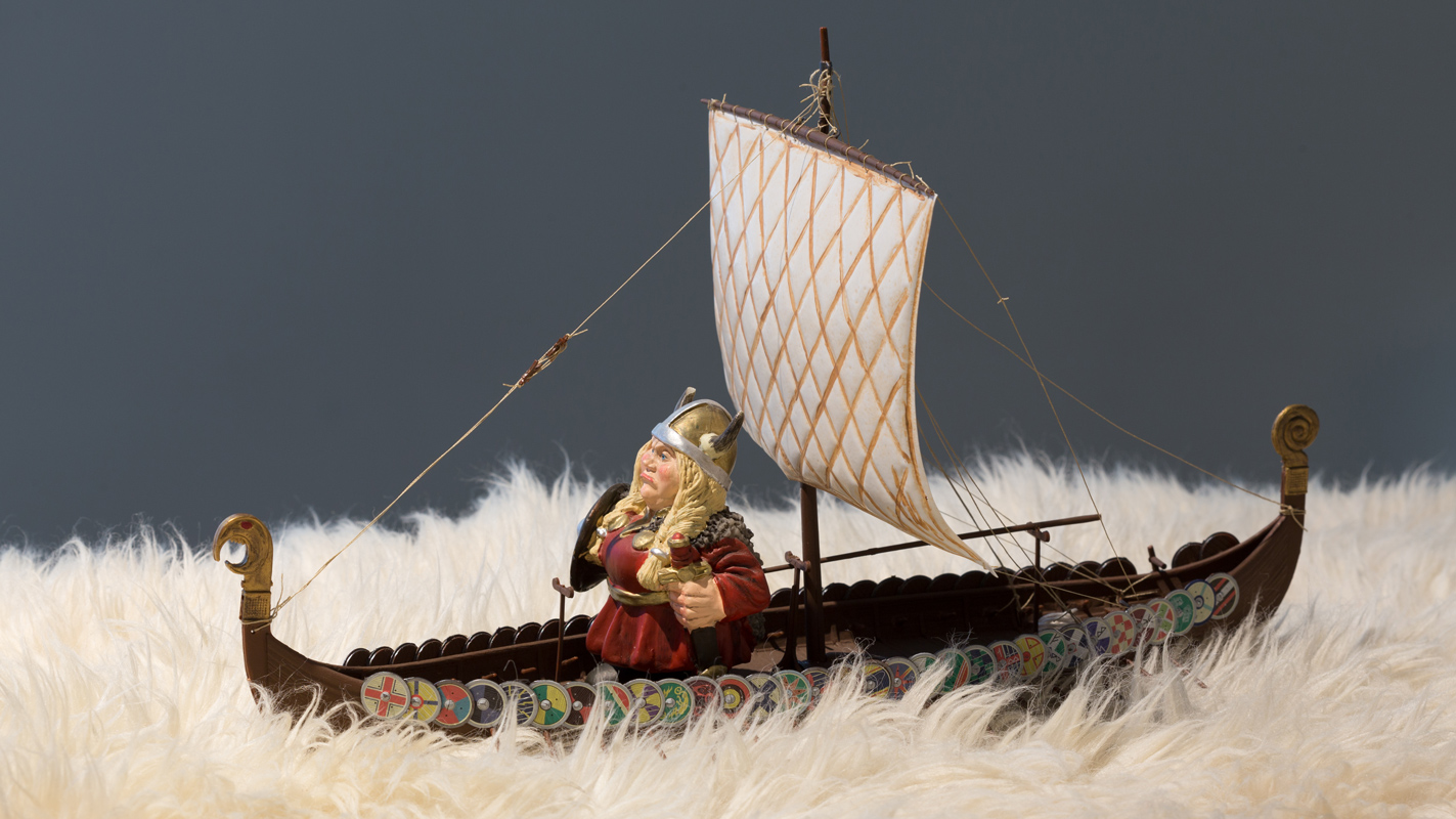   Go You Must , 2017 viking ship, figure, sheepskin; 10.5 x 14.5 x 9 inches (not inclusive of sheepskin) 