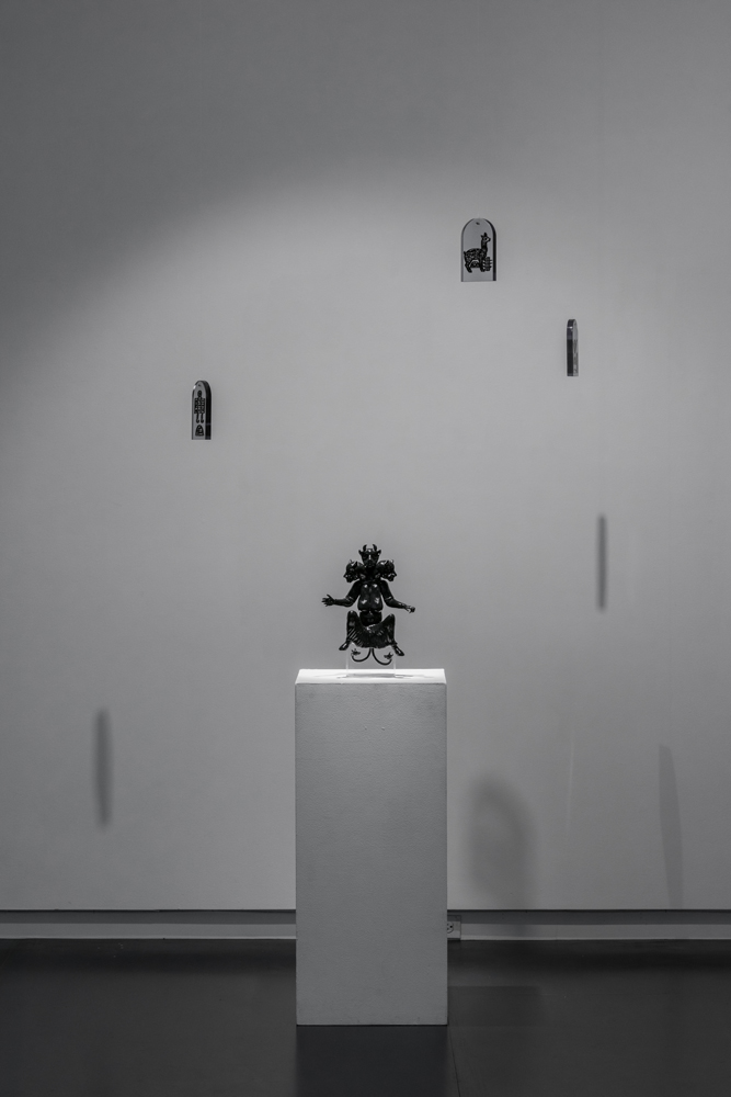   Huma and Talismans , 2016 3D printed black resin sculpture: 12 x 6 x 5 inches; 3D printed clear resin talismans: 3 x 2 x 1 inches (each); edition of 3 plus 2 AP 