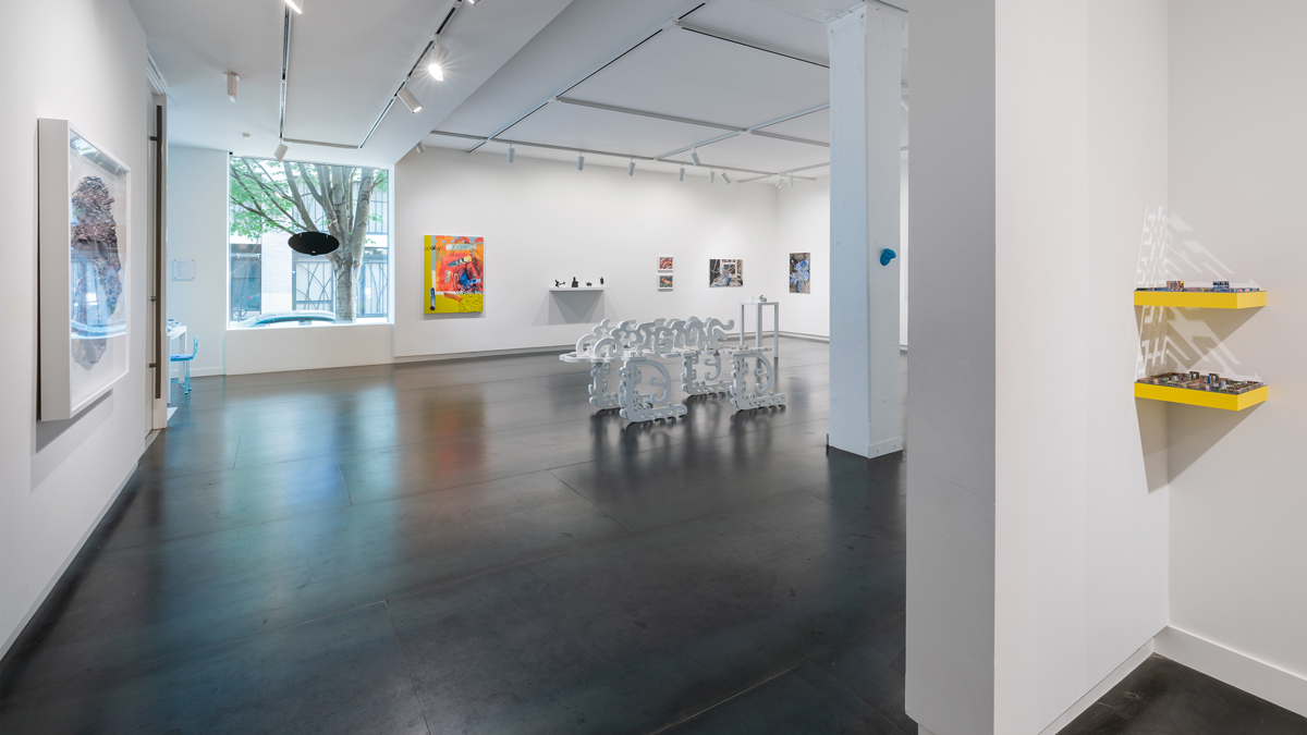  artists, left to right: Ben Buswell, Julie Green, Heidi Schwegler (facing window), Jack Featherly, Morehshin Allahyari, Ralph Pugay, Srijon Chowdhury, Brenna Murphy (on floor and yellow shelves) 