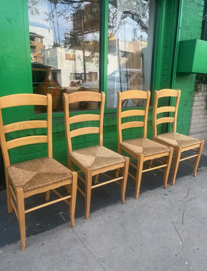 Set of four ladder back dining chairs with rush seats