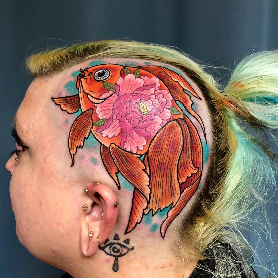Burly fish tattoo & piercing