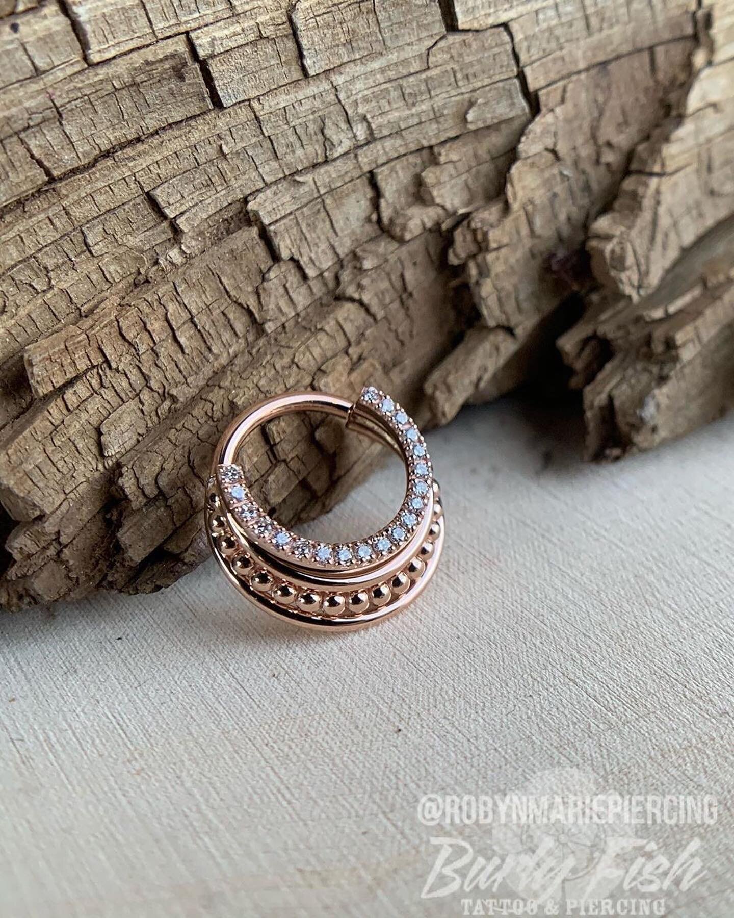 Jewelry fit for a queen, this &ldquo;Brit&rdquo; clicker is hand crafted out of solid 14kt rose gold and set with 21 genuine white diamonds. Is this the most stunning piece of jewelry @robynmariepiercing has ever held in her own hands? Definitely. Sw