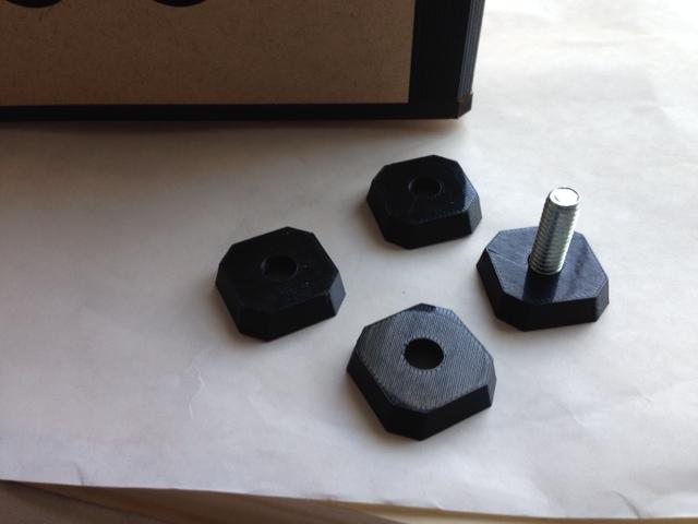 After the frame assembled without a problem, I 3D printed some feet that hide the bottom bolts and raise the unit too.