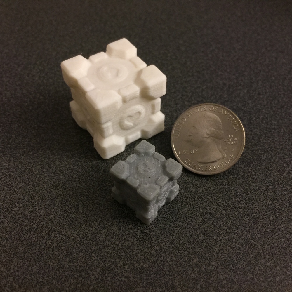  The heart on the side of the gray cube printed clearly but the heart on top is muddled due to the nozzle's relatively large diameter for features perpendicular to the nozzle 