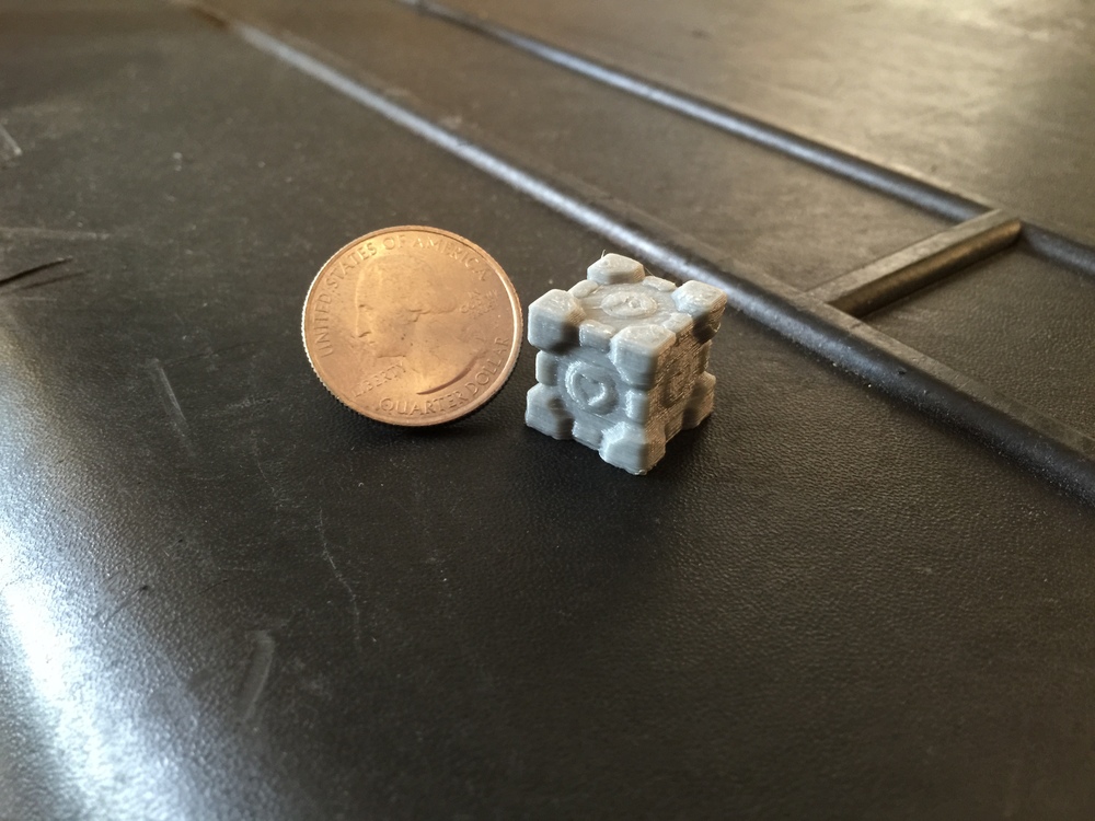  The heart on the side of the gray cube printed clearly but the heart on top is muddled due to the nozzle's relatively large diameter for features perpendicular to the nozzle 