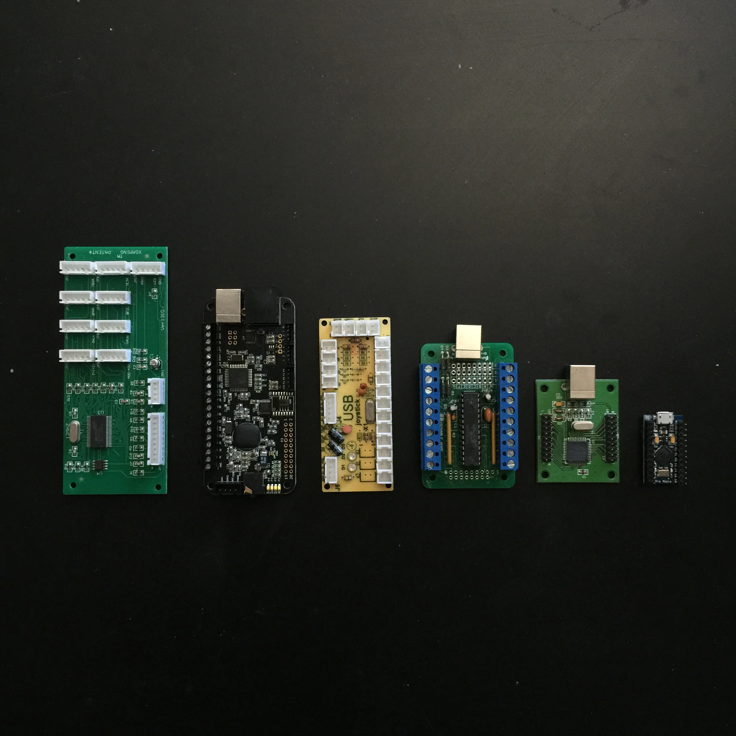 Some of the button encoders we've tested, our newest Arduino powered one on the far right.