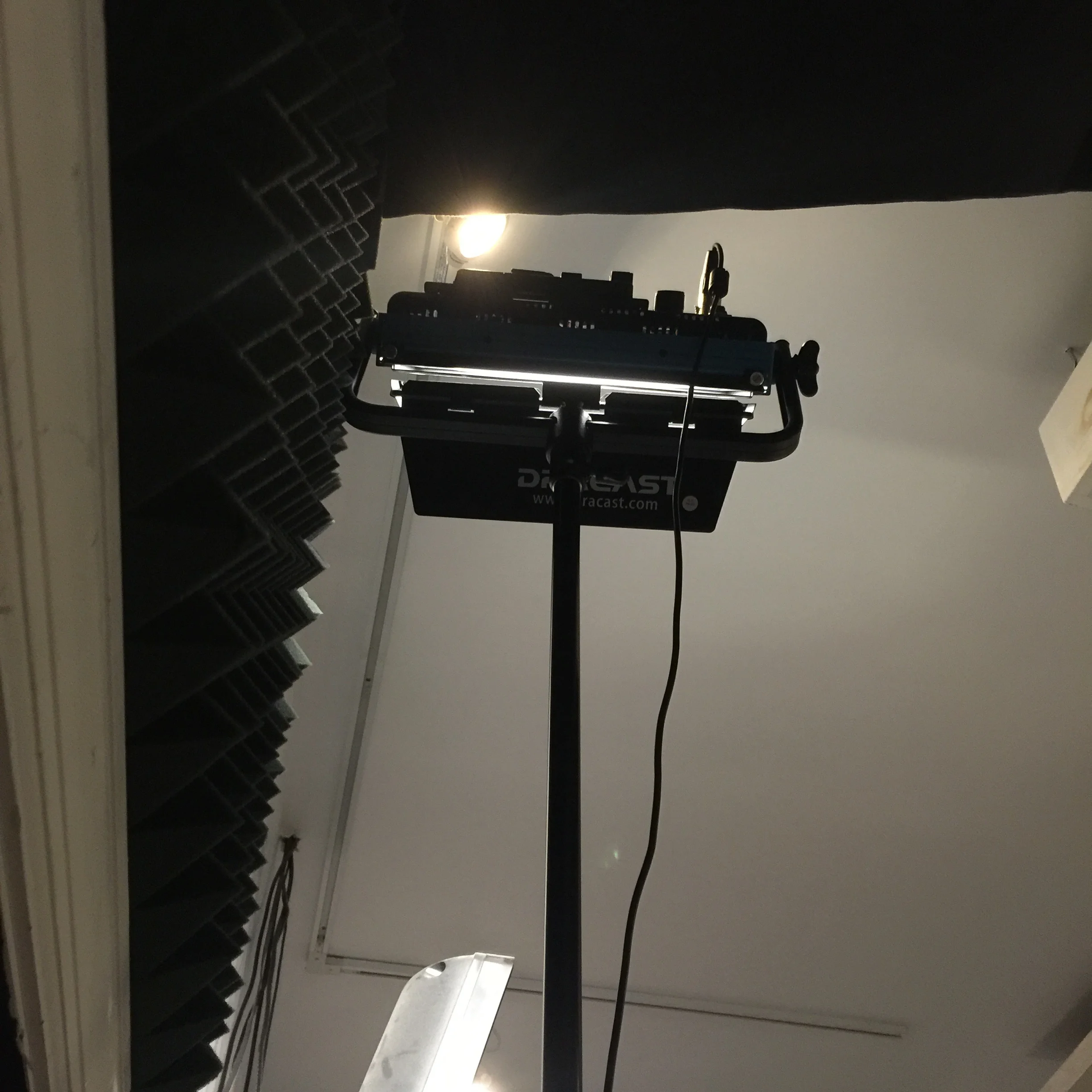 using one of the lights inside the piano room to make the room brighter