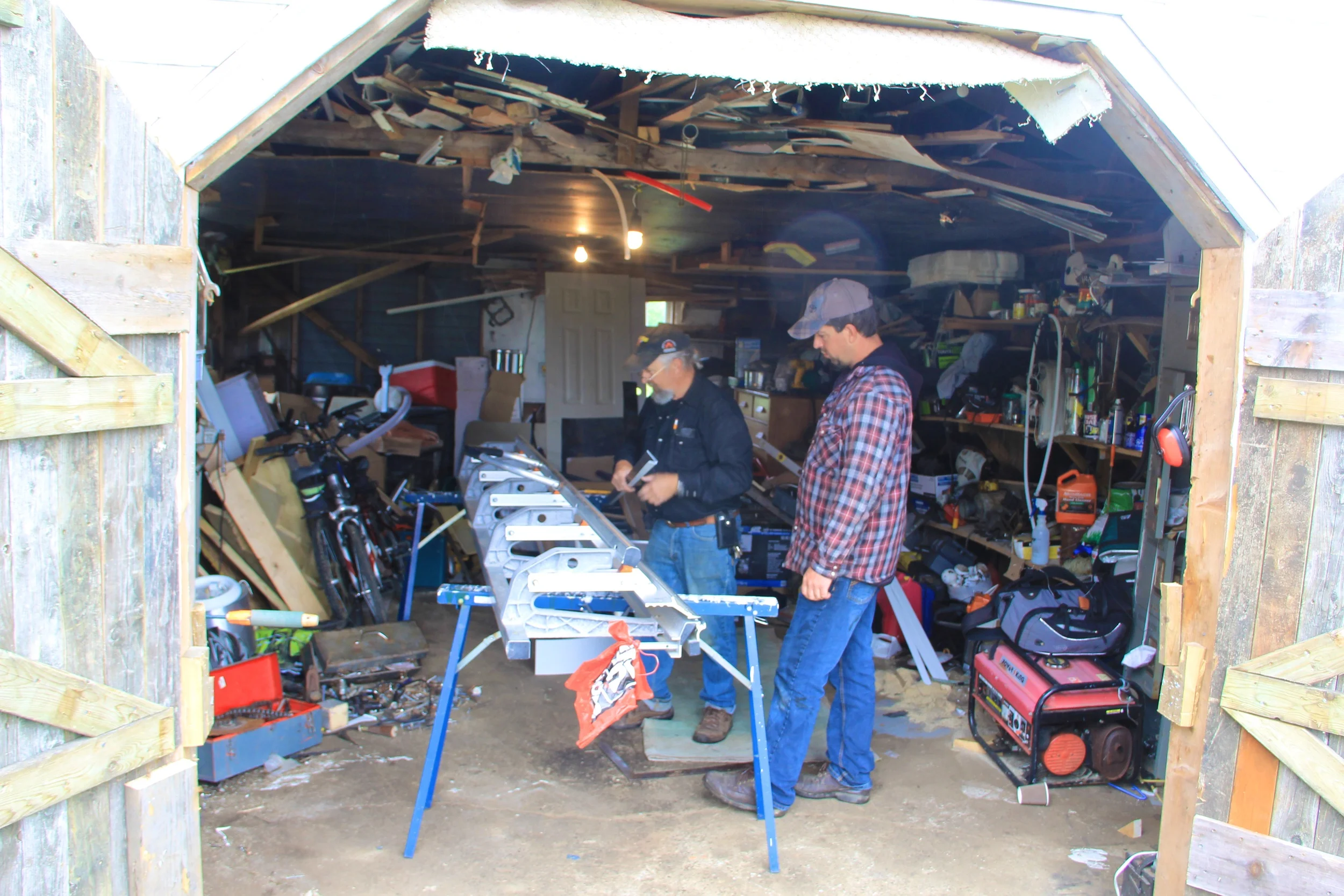 Richard showing Steve how to bend and assemble the metal strips that will give the dome a good looking professional finish.