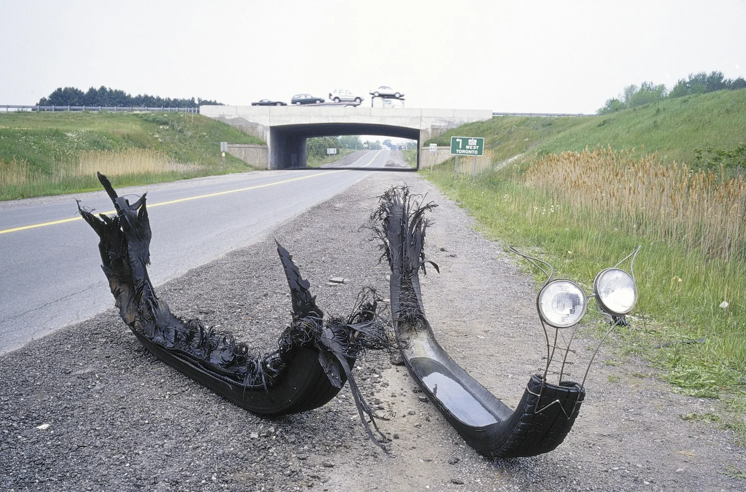 Tire Vessel # 1, 2001 Transport truck tire, water, steel dowelling, truck headlights, wire corseting
105 x 330 x 65 cm 
