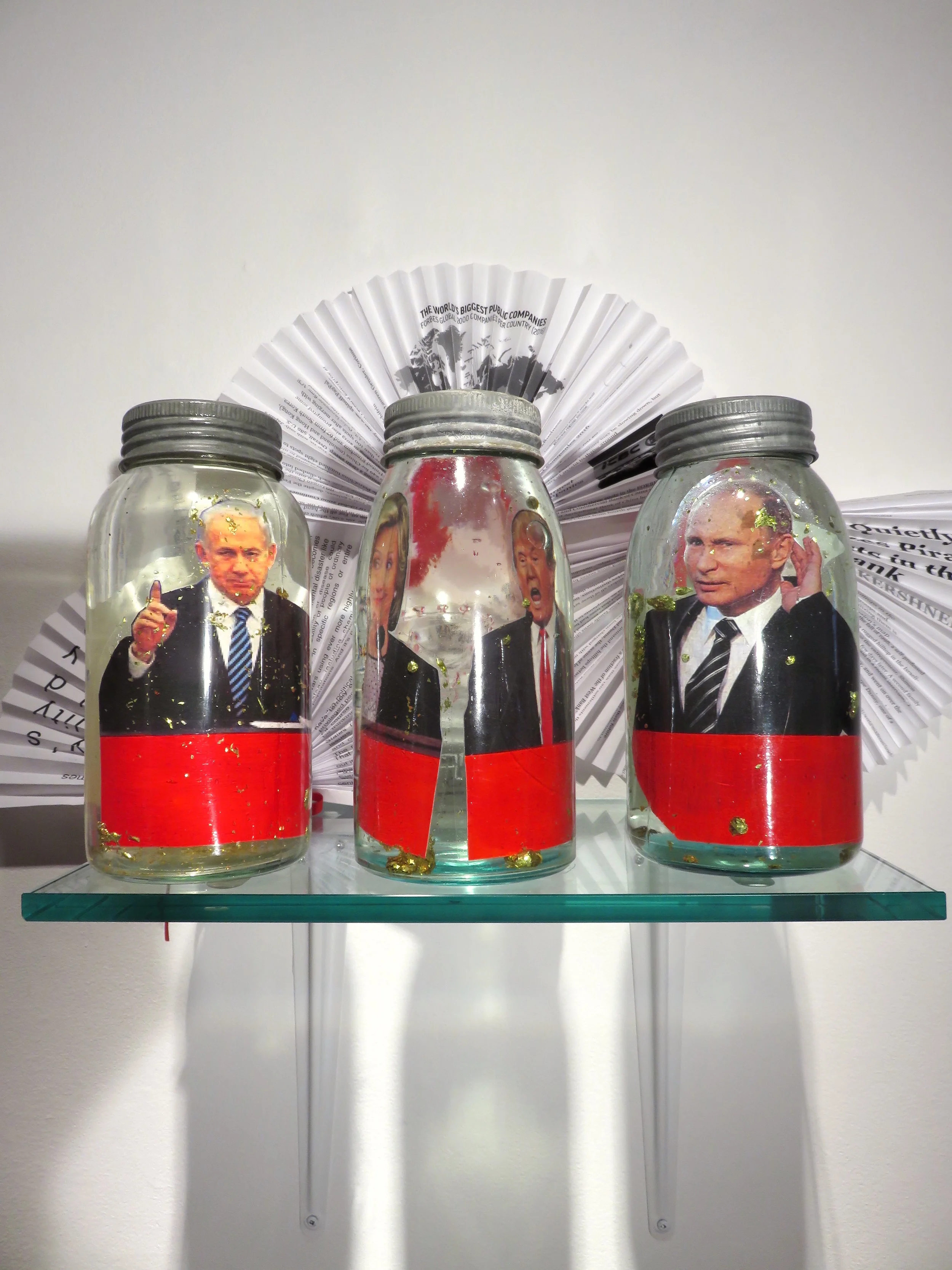 World Powers Vignette , 2016 pickling jars, plastic, paper, metal, 10 x 16 x 11 inches