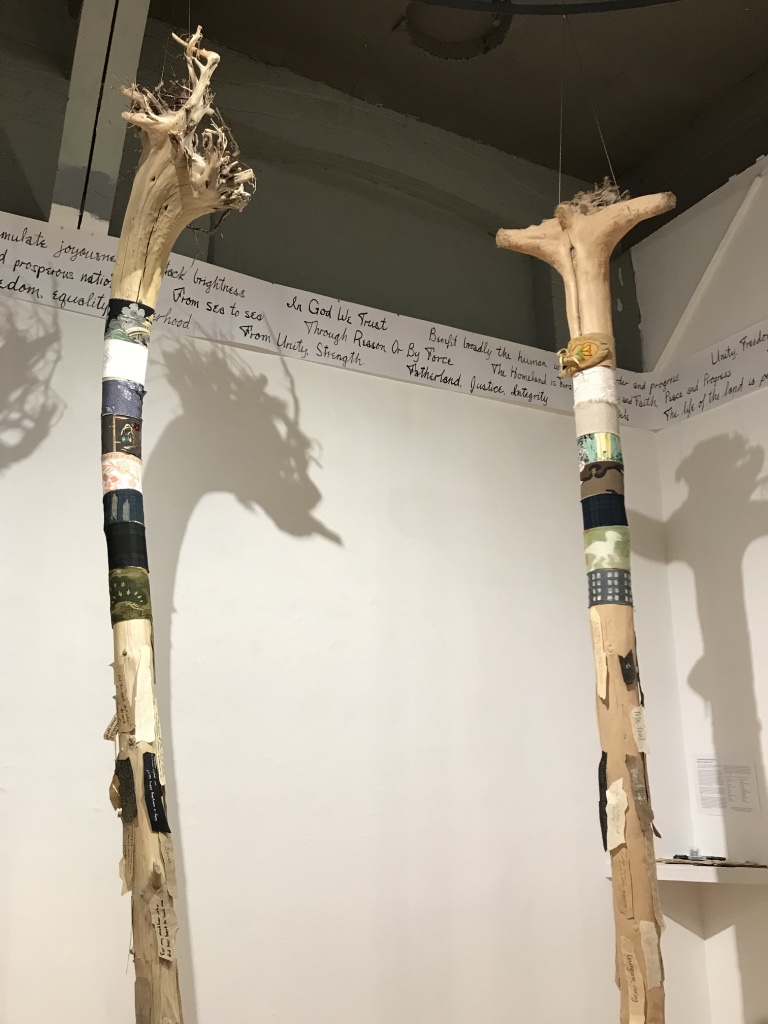   Around The World: Unity in Diversity,  2017 - 2018 12 driftwood tree trunks, multi-cultural fabrics, paper ”barks" Installation view at the Red Head Gallery   Mottos of Many Countries , 2018 Paper, ink, mottos from Wikipedia Installation view at th