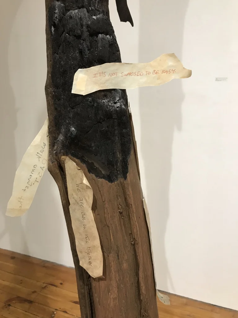 Around The World: Unity in Diversity (Detail) , 2017 - 2018 12 driftwood tree trunks, multi-cultural fabrics, paper ”barks"