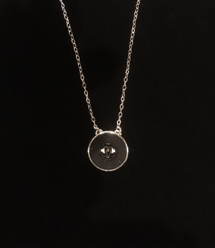 black rubber chanel on blk.jpeg